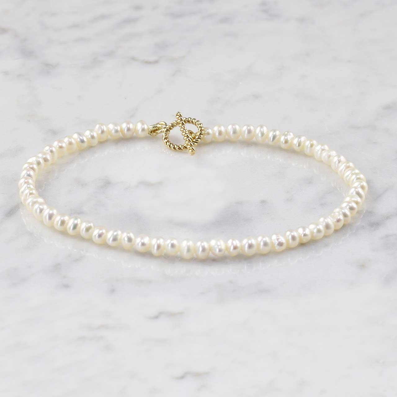 goud slotje parelketting echte parels