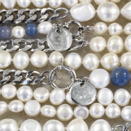 Close-up of handmade pearl necklaces from the Claude X Proud Pearl collection