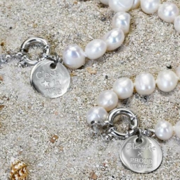 Close-up of handmade pearl necklaces from the Claude X Proud Pearl collection