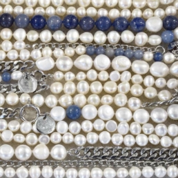Close-up of handmade pearl necklaces from the Claude X Proud Pearl collection