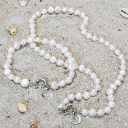 Close-up of handmade pearl necklaces from the Claude X Proud Pearl collection