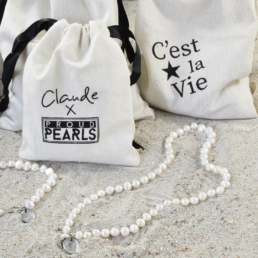 Close-up of handmade pearl necklaces from the Claude X Proud Pearl collection
